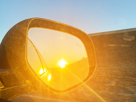 Sun reflection in side mirror of a car