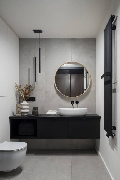 Spacious bathroom with decorative concrete style tiles stock photo
