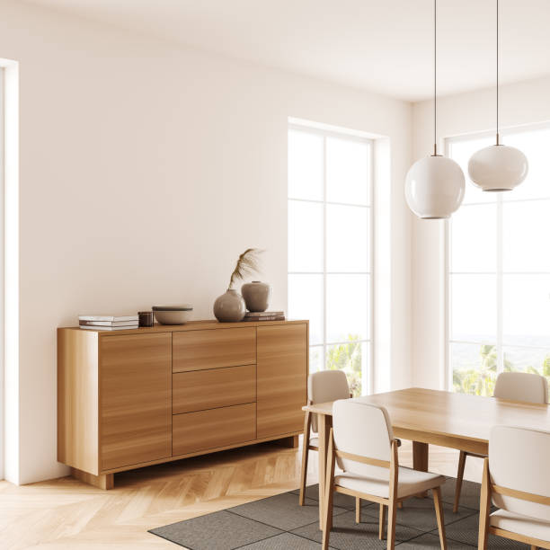 istock Light dining room interior with table and dresser, panoramic window and mockup 1405451192