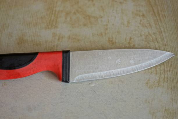 istock one knife with a black red plastic handle and a white metal wet blade 1405451587