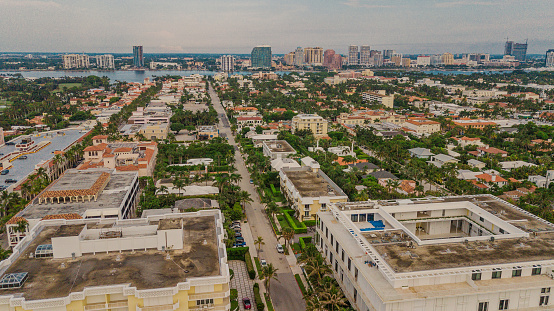 Aerial Drone View of Beach-Front Real Estate in Palm Beach, Florida During a Golden Summer Sunrise on June 25, 2022.