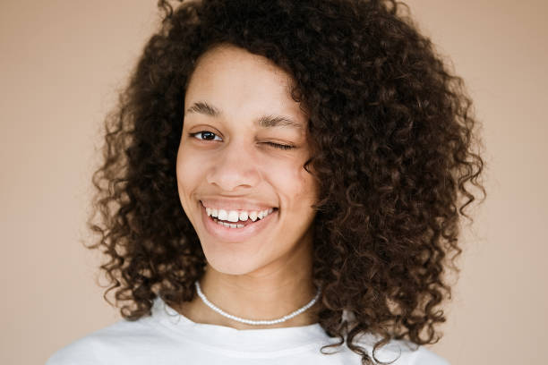 istock Girl winking one eye mouth 1405451759