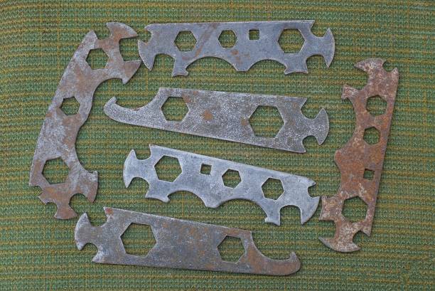 istock old rusty iron bicycle tool lie on a green cloth 1405451816