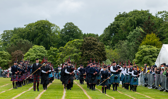 19 June 2022. Hazlehead, Aberdeen, Scotland. This is the massed Pipe Bands on the arena circuit at the Aberdeen Highland Games.
