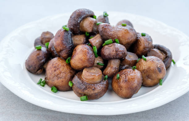 istock Stir-fry button mushrooms 1405462144