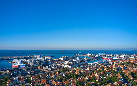 Aerial view of harbor with fishing ships. Famous beach 