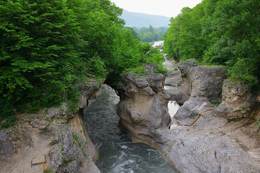 Khadzhokh gorge. The narrow part of the gorge of the Belaya River. Kamennomostsky canyon. Bubbling mountain river Belaya. Adygea
