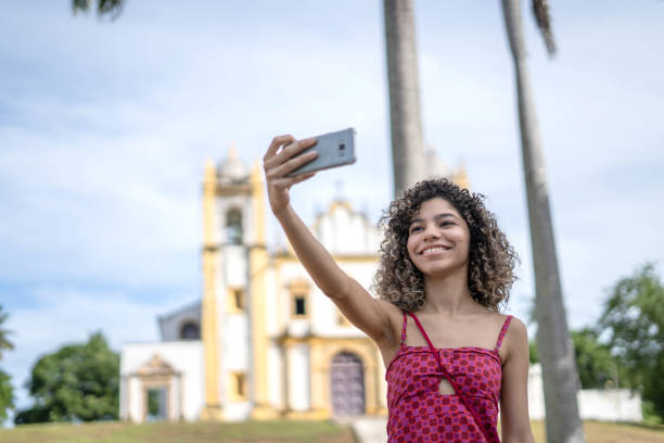 istock Young man taking selfie in the city 1405465729