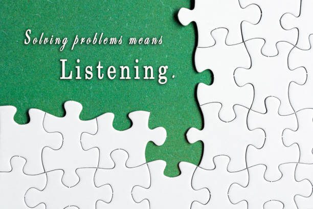 Motivational quote on white jigsaw with missing pieces on green background.