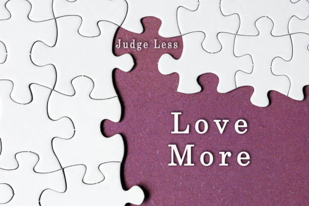 istock Motivational quote on white jigsaw with missing pieces on purple background. 1405465814