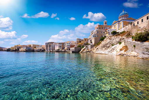 The emerald sea at the Vaporia district, city of Ermoupoli at Syros island, Cyclades, Greece, during a sunny summer day