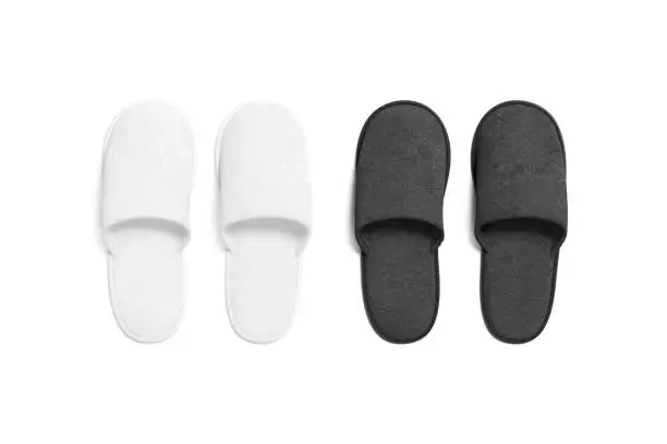 Blank black and white home slippers mockup, top view, 3d rendering. Empty cozy wool slipshoe for hotel or house wear mock up, isolated. Clear fluffy footwear pair for domestic template.