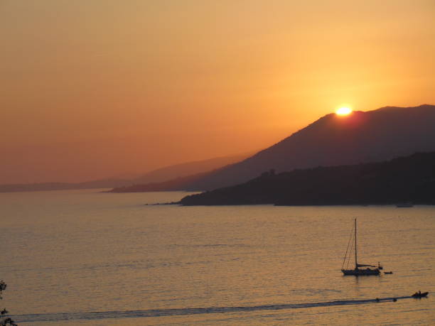 Sunset view with the sea and hills, peaceful atmosphere