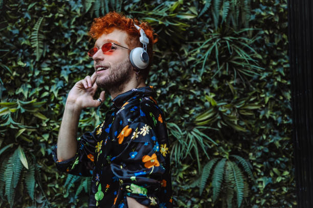 istock Gay man with headphones 1405471237