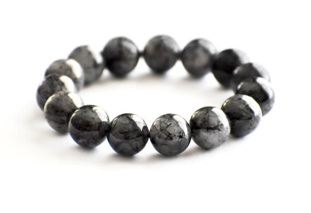 istock Black rutilated quartz bracelet on white background. 1405475311