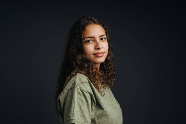 istock Young woman with curly hair in studio 1405476370