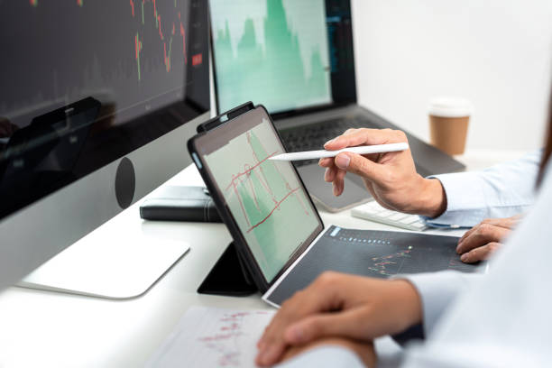 istock Investor business team working with computer, tablet and analyzing graph stock market trading planning with chart data financial investment planning 1405477762