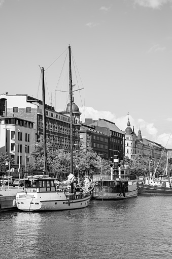 Helsinki, Finland - July 26, 2017: Waterfront with vintage boats by quayside in Helsinki. Black and white photography
