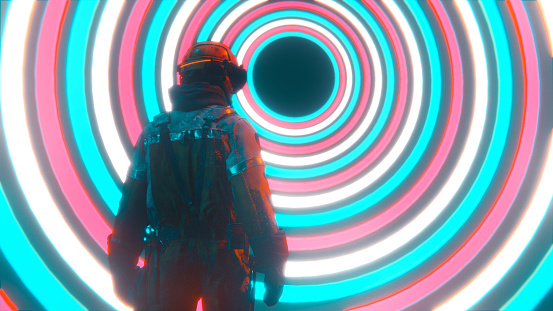 Man with headwear stands in front of spiral portal. Concept of the metaverse.
