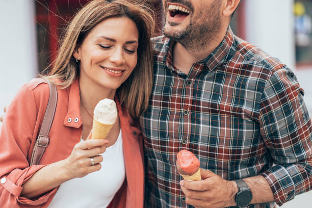 istock Happy couple eating ice cream 1405480128