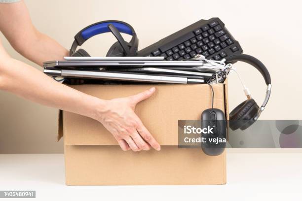 Woman Hands Holding Cardboard Box Full Old Used Computers Phones Tablets Gadget Devices For Recycling Planned Obsolescence Ewaste Donation Electronic Waste For Reuse And Recycle Concept Stock Photo - Download Image Now