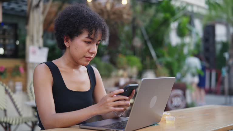 Businesswoman checking her work on laptop