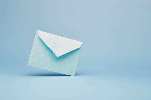 istock Bright blue office envelope for greeting or invitation on the blue background 1405482225