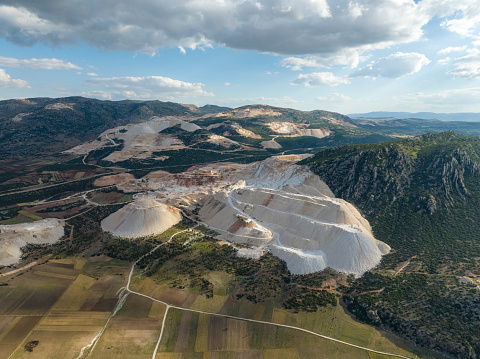 Marble quarry in front of fields. Burdur / Turkey. Taken via drone.