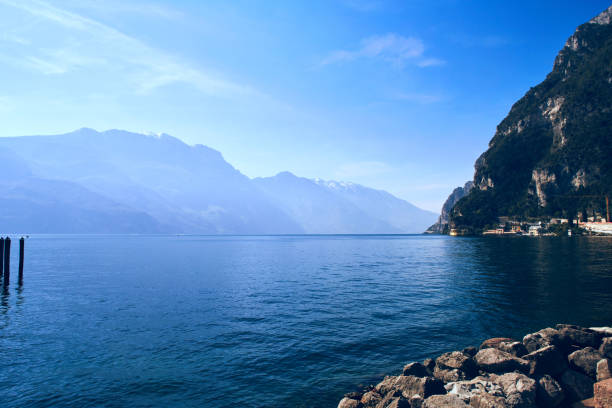 istock Garda lake with alpine mountain and blue sky on the background 1405482324