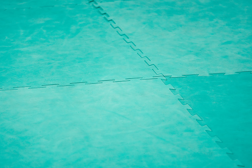 Karate tatami turquoise. Background for sports martial arts.