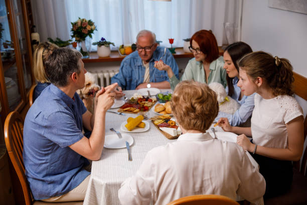 istock Multigeneration family having dinner and chatting casually 1405486072
