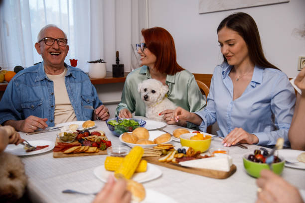 istock Joyful multigeneration family bonding during dinner they are enjoying 1405486074
