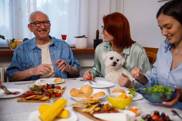 istock Senior man having dinner with his daughter and granddaughter 1405486087