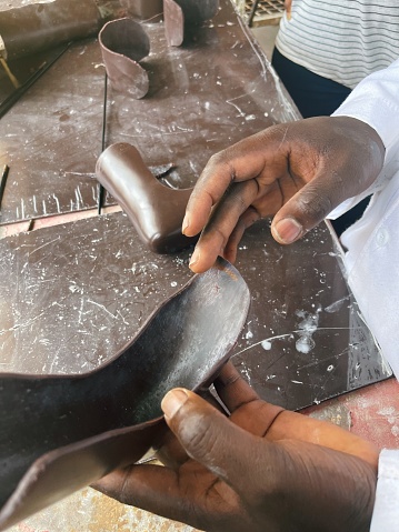 Universal design, artisan making assistive devices for persons with disabilities