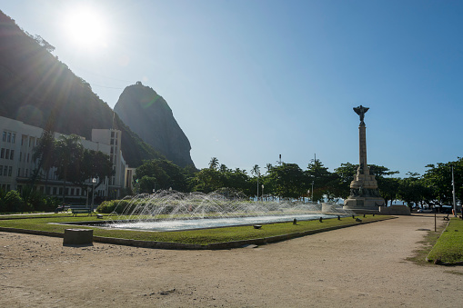 Rio de janeiro Brazil. May 24, 2022: Fountain at General Tibúrcio square. In the background, The Sugarloaf mountain.