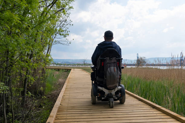 istock Man on wheelchair in nature 1405487925