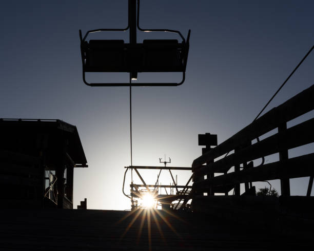 The setting sun shines near the cable car, evening calm, twilight, a good end to a summer day, Austria