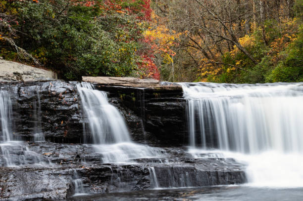 istock Refreshing Waterfall Hidden Deep in the Autumn Forest 1405490725