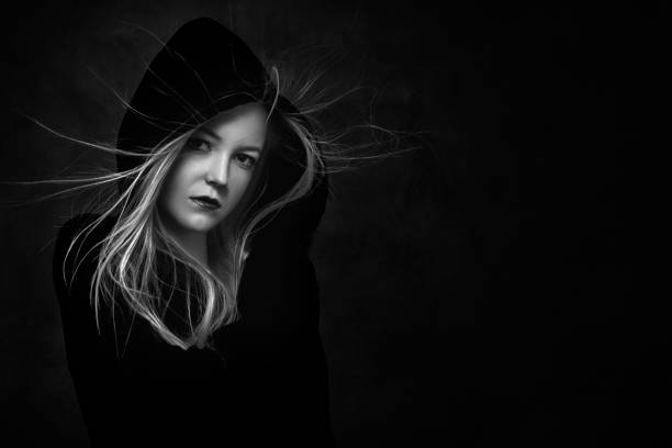 istock scared girl in hood 1405492954
