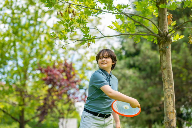 istock 11 years old boy playing games  in nature 1405494168