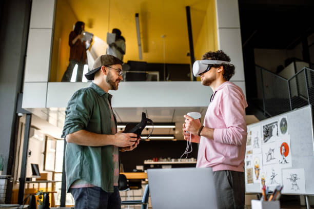 istock Group of coworkers testing VR simulator in the office 1405498543