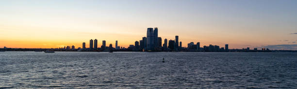 istock Jersey City silhouetted against a dramatic sunset 1405500532