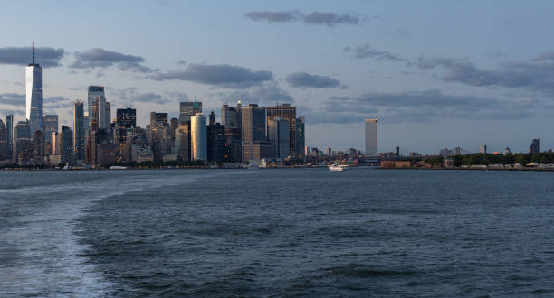 istock Lower Manhattan skyline at sunset viewed from the water. 1405500540