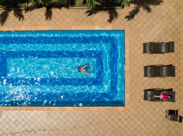 istock Elderly man enjoying the swimming pool in summer 1405504499