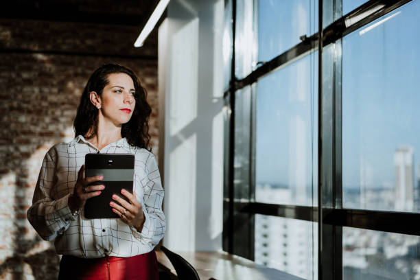 istock Businesswoman holding a digital tablet 1405507193