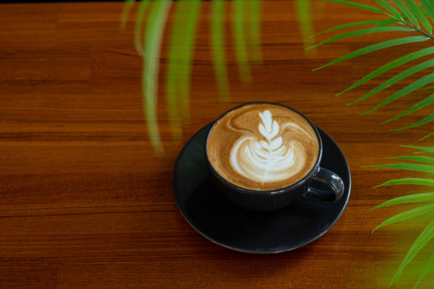 istock hot latte art coffee on wood table, relax time 1405508942