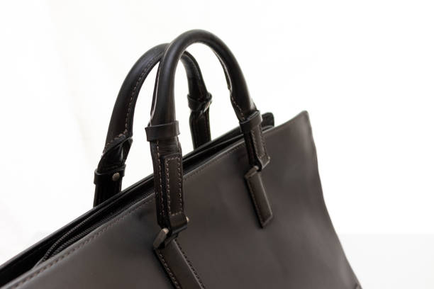 istock Close up on the handle of a black business bag 1405509152