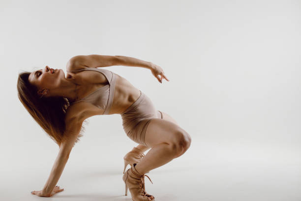 istock Young woman dancer dancing high heels dance. 1405510248