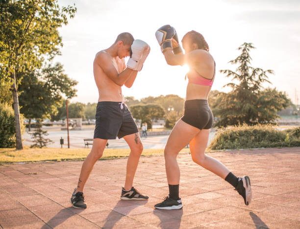 istock Two athletes are training boxing in the park 1405512440