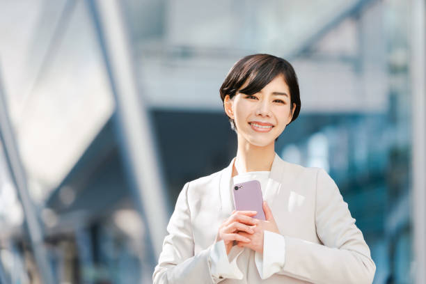 istock Woman in a suit with a smartphone 1405517670